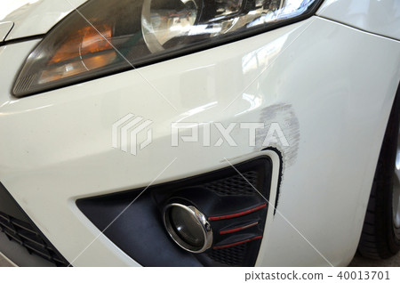 Bumper of a white car following a car accident. Bumper of a white car following a car accident. 40013701