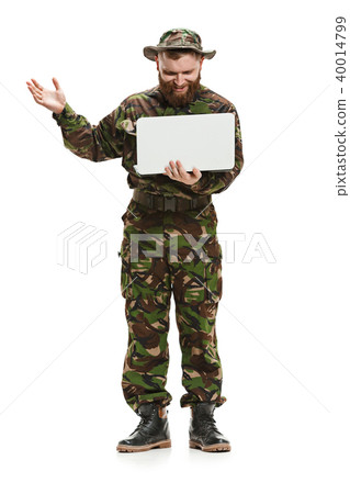 Young army soldier wearing camouflage uniform isolated on white Young army soldier wearing camouflage uniform isolated on white 40014799