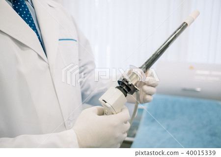 Proctologist holding an anoscope. In the hospital 40015339