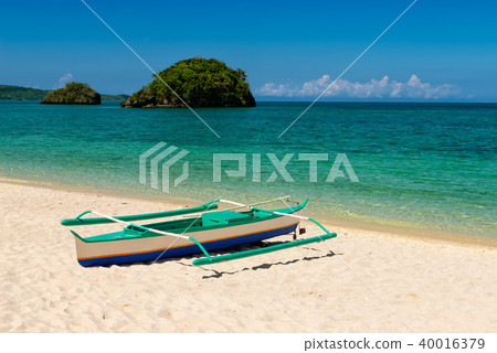 fishboat on sand on tropic turquoise sea fishboat on sand on tropic turquoise sea 40016379