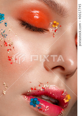 Beautiful girl with art make-up and flowers. beauty face. Beautiful girl with art make-up and flowers. beauty face. 40017745