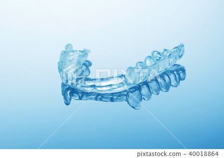 night dental guard by bruxism on blue background 40018864