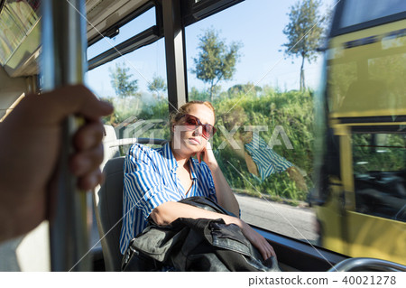 Portrait of tired woman sleeping on bus. Portrait of tired woman sleeping on bus. 40021278