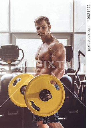 handsome strong bodybuilder men pumping up muscles 40021411