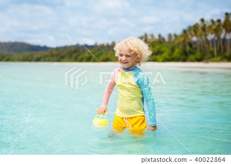 Child on tropical beach. Sea vacation with kids. Child on tropical beach. Sea vacation with kids. 40022864