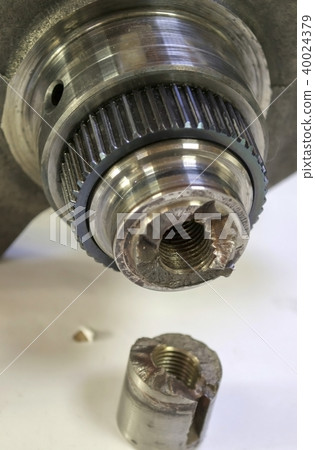 The car engine part broken in half. Crankshaft The car engine part broken in half. Crankshaft 40024379