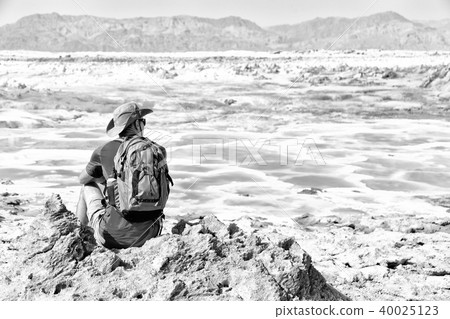 near the depression volcano land a  backpacker 40025123