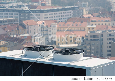 Air conditioning ventilators on roof with houses 40026576