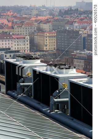 Air conditioning ventilators on roof with houses 40026578