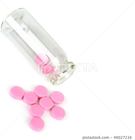 Medical  pills in a glass bottle isolated  40027216