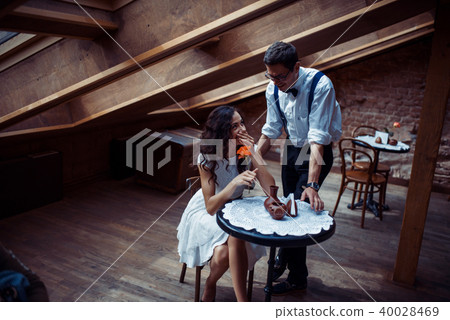 Romantic couple in love bonding in cafe Romantic couple in love bonding in cafe 40028469