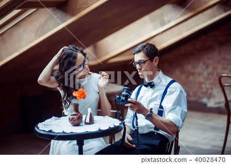 Romantic couple in love bonding in cafe Romantic couple in love bonding in cafe 40028470
