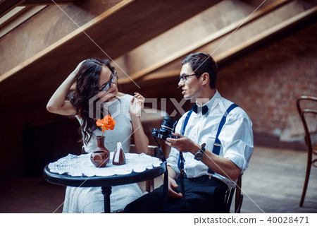 Romantic couple in love bonding in cafe Romantic couple in love bonding in cafe 40028471