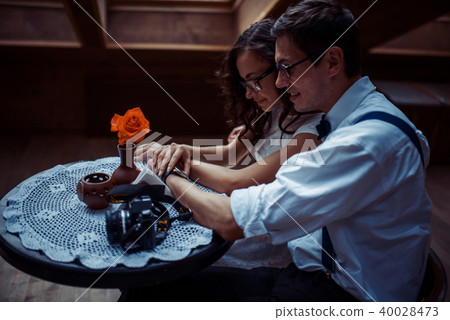 Romantic couple in love bonding in cafe Romantic couple in love bonding in cafe 40028473