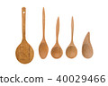 Old wooden spoons and stirrers on white background 40029466
