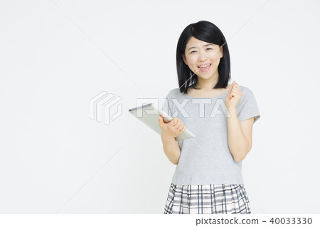 Young woman with tablet Young woman with tablet 40033330