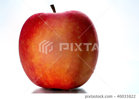 A red apple with water drops on skin isolated 40033822