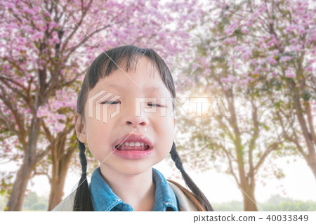 girl with running nose from flower pollen allergy girl with running nose from flower pollen allergy 40033849