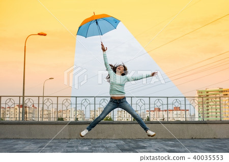 girl holding an umbrella is in a comfortable clim girl holding an umbrella is in a comfortable clim 40035553