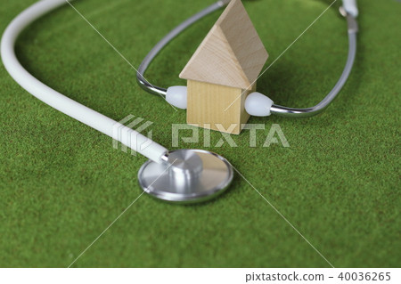 Examine the house of blocks placed on the lawn with a stethoscope 2 Examine the house of blocks placed on the lawn with a stethoscope 2 40036265