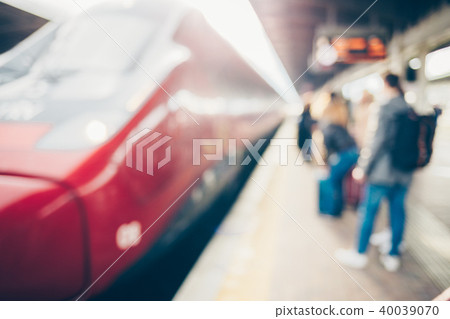 Blurred passenger at railway station traveling by train. Blurred passenger at railway station traveling by train. 40039070
