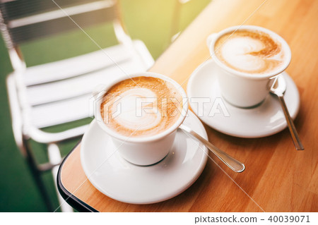 Two cup of cappuccino with latte art. Two cup of cappuccino with latte art. 40039071