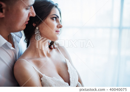 Wedding couple in hotel room Wedding couple in hotel room 40040075