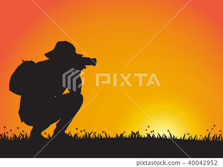Silhouette of man using camera during sunset Silhouette of man using camera during sunset 40042952