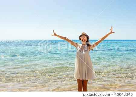 Freedom woman in free happiness bliss on beach. Freedom woman in free happiness bliss on beach. 40043346