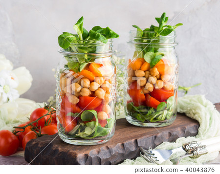 Fresh salad lunch served in mason jars 40043876