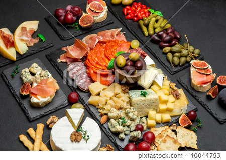 various type of italian meal or snack - cheese, sausage, olives and parma various type of italian meal or snack - cheese, sausage, olives and parma 40044793