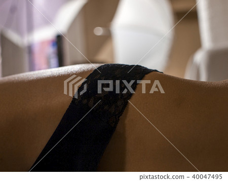 Contour of a feminine thigh in lacy underwear Contour of a feminine thigh in lacy underwear 40047495