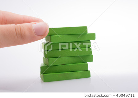 Hand holding color dominoes 40049711