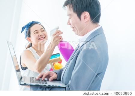 Couple buy a new home. Cleaning house and working 40053990