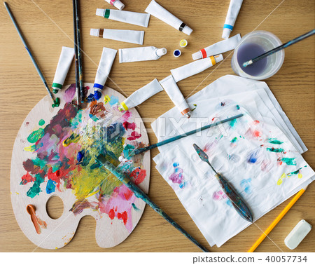 palette knife, brushes and paint tubes on table palette knife, brushes and paint tubes on table 40057734