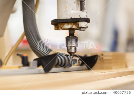 drill press machine and wooden board at workshop drill press machine and wooden board at workshop 40057736