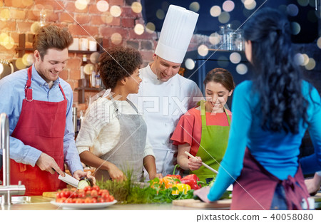 happy friends and chef cook cooking in kitchen happy friends and chef cook cooking in kitchen 40058080