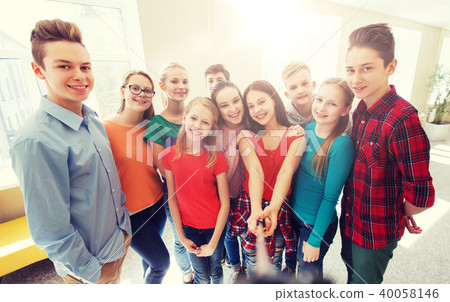 group of students taking selfie with smartphone group of students taking selfie with smartphone 40058146