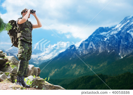 soldier with backpack looking to binocular soldier with backpack looking to binocular 40058886