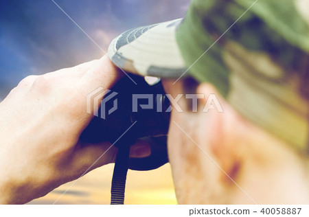 close up of soldier looking to binocular close up of soldier looking to binocular 40058887