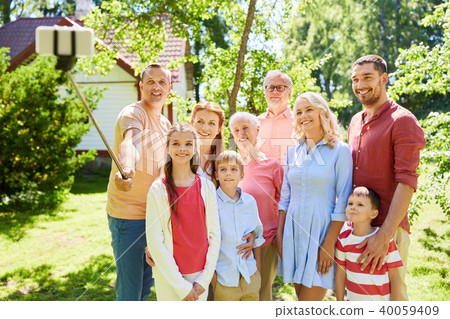 happy family taking selfie in summer garden 40059409
