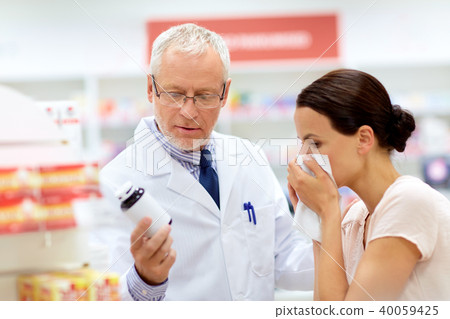 apothecary and sick customer at pharmacy apothecary and sick customer at pharmacy 40059425