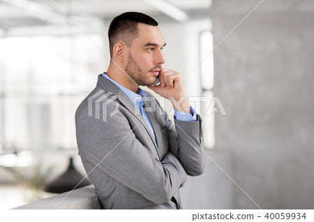 businessman calling on smartphone at office businessman calling on smartphone at office 40059934