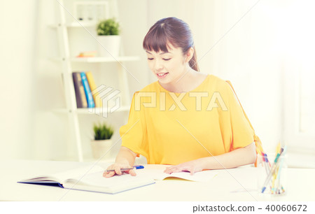 happy asian young woman student learning at home 40060672
