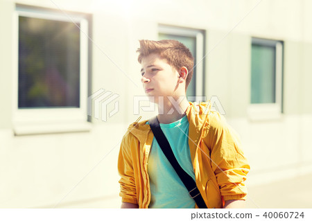 teenage student boy walking outdoors teenage student boy walking outdoors 40060724
