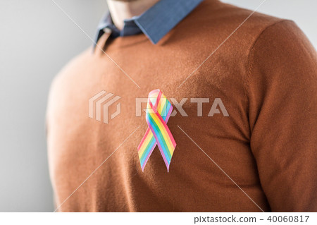 man with gay pride rainbow awareness ribbon 40060817