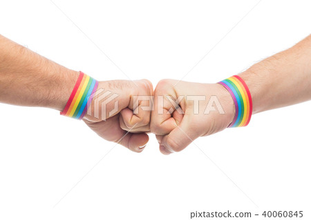 hands with gay pride wristbands make fist bump 40060845