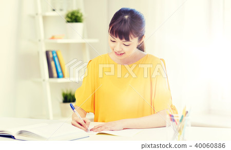 happy asian young woman student learning at home happy asian young woman student learning at home 40060886