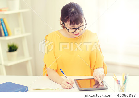 asian woman student with tablet pc at home asian woman student with tablet pc at home 40060888