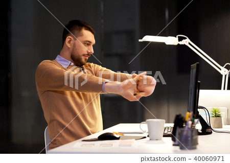 man with computer working late at night office man with computer working late at night office 40060971